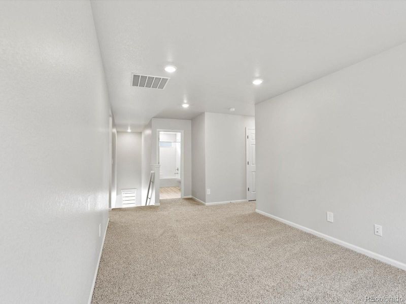 Spacious, unfurnished interior of a new home in Ridgeline Vista: The Canyon Collection, Brighton (Image 30).