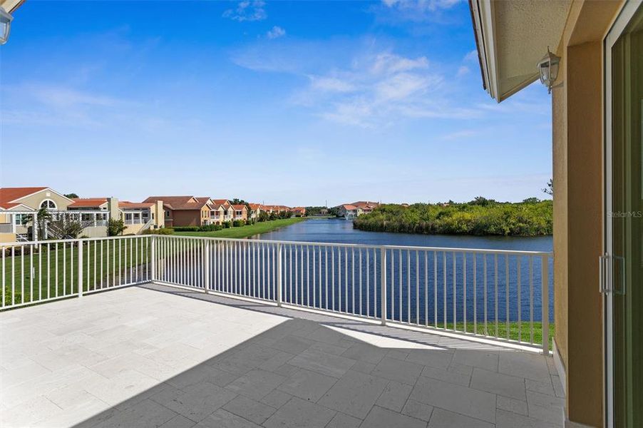 Open Lanai overlooking lagoon and preserve, off of Great Room and Main Bedroom.