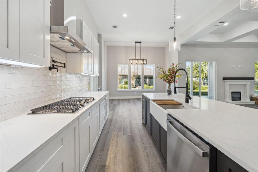 Beyond the dream Kitchen is the Dining Area. Althougth this room could be used for anything and the Dining Room could be an Open Floor Plan between the Kitchen Island and the Great Room.  So many options...