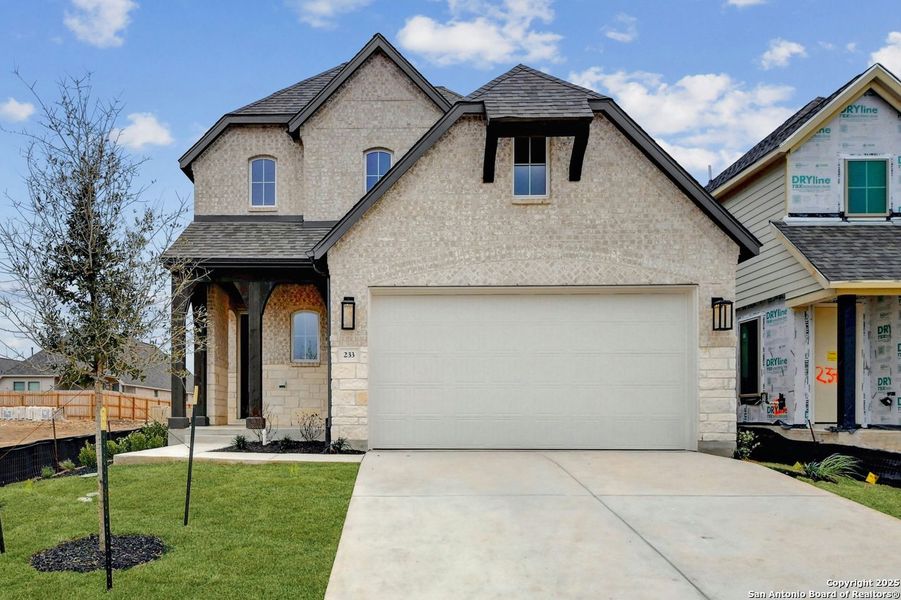 Front exterior of a new home in Legacy at Lake Dunlap: 40ft. lots - (A), New Braunfels, TX, highlighting curb appeal (Image 1).