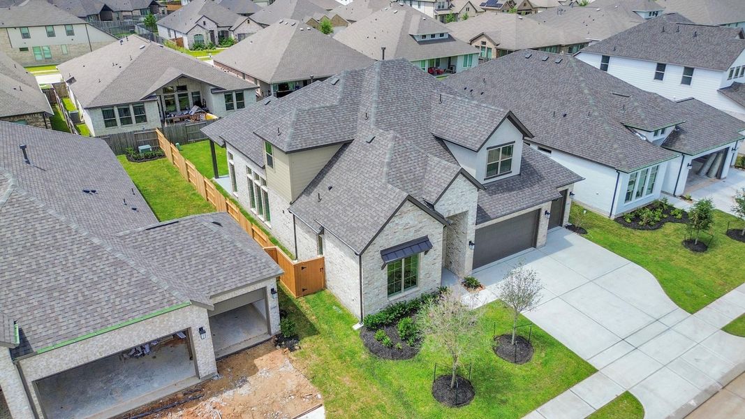 Front exterior of a new home in Marvida, Cypress, TX, highlighting curb appeal (Image 2).