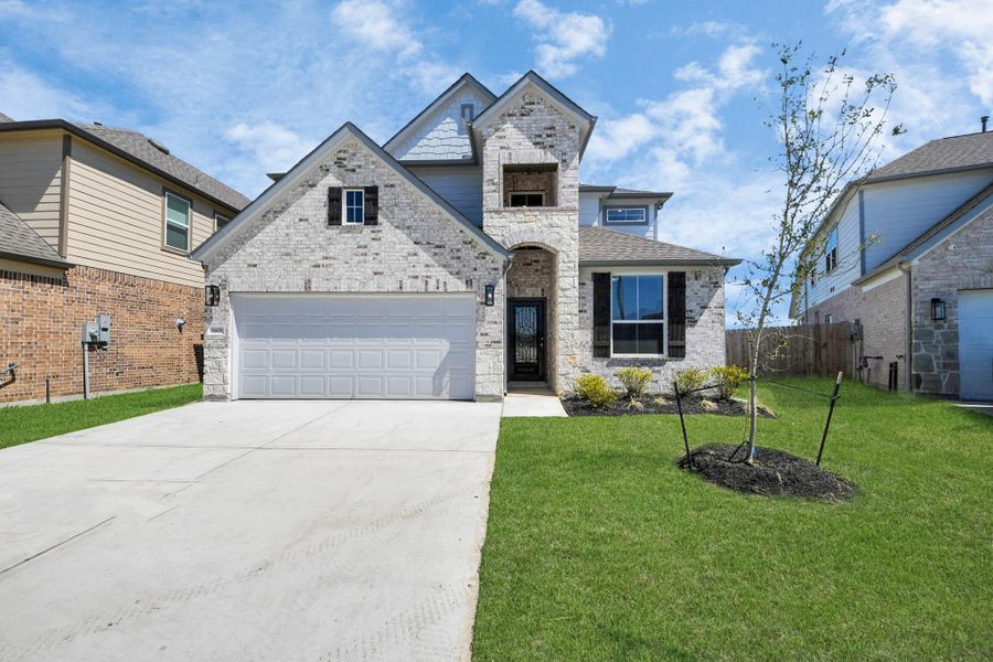 Home features a convenient 2-car garage complemented by a spacious driveway, offering ample parking for you and your guests. Home features a convenient 2-car garage complemented by a spacious driveway, offering ample parking for you and your guests.