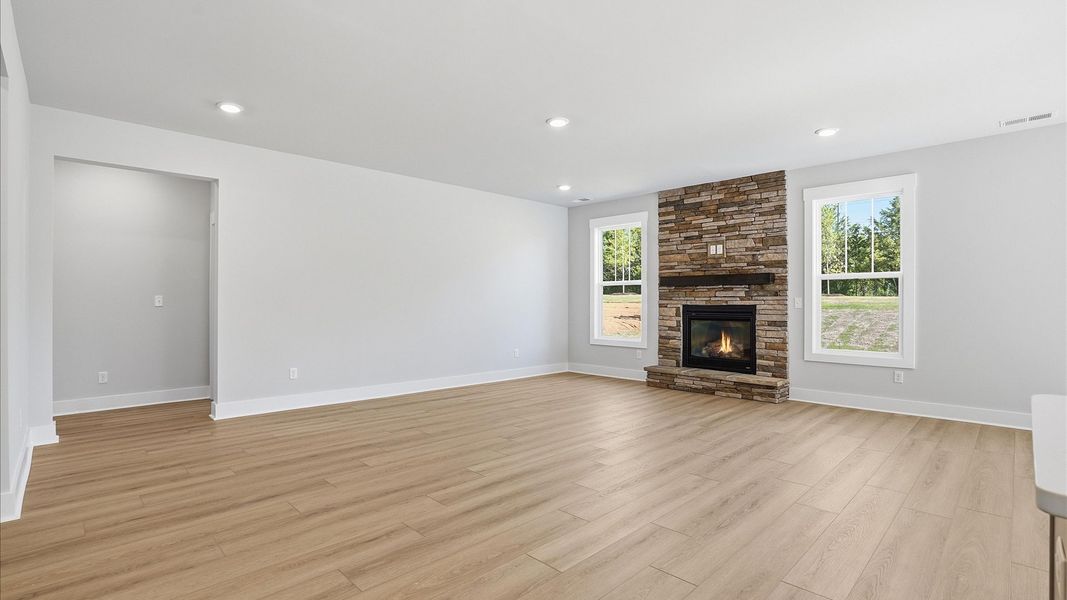 Exceptional family space with hardwood floors and seamless flow to dining and kitchen areas located at Benjamin's Grove Exceptional family space with hardwood floors and seamless flow to dining and kitchen areas located at Benjamin's Grove