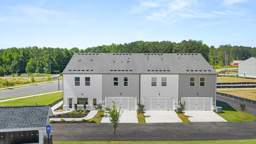 Front exterior of a new home in Echo Glen, Stockbridge, GA, highlighting curb appeal (Image 2).