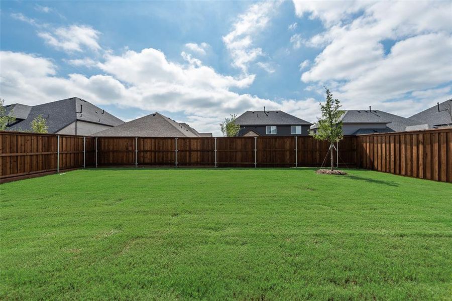 Exterior details and patio area of a home in Spiritas Ranch, Little Elm (Image 3).