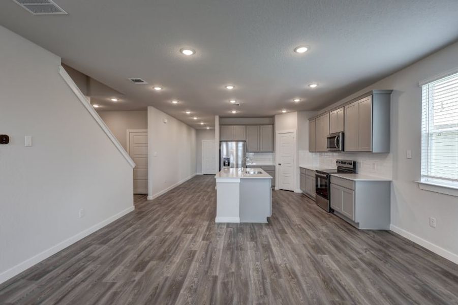 A kitchen with white cabinets. A kitchen with white cabinets.