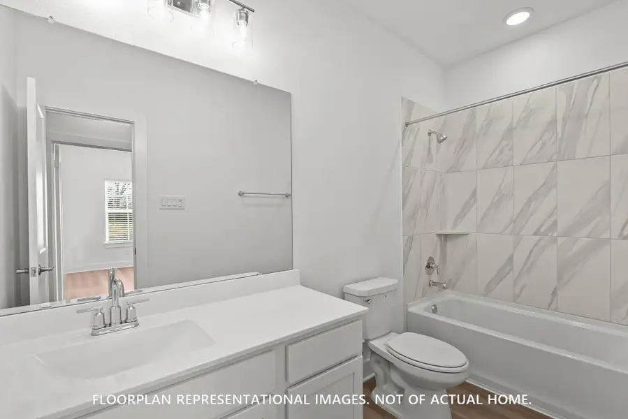 Furnished interior view inside a new home in Sorella, Tomball (Image 11).