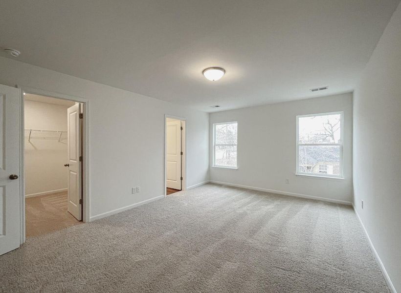 Spacious, unfurnished interior of a new home in East Main Townes, Spartanburg (Image 23).