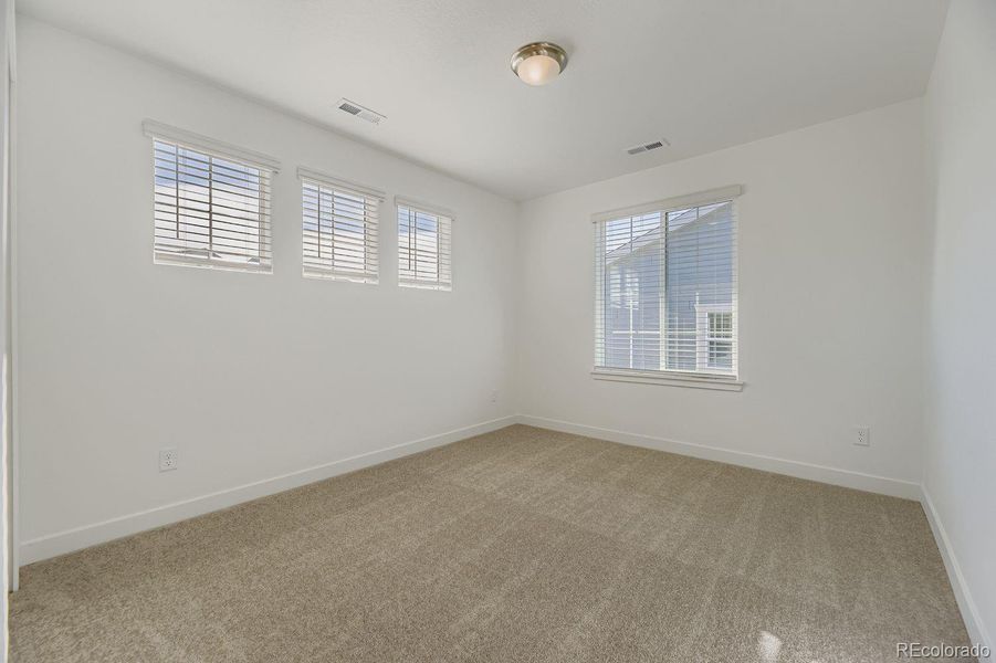 Spacious, unfurnished interior of a new home in Newlin Crossing: The Monarch Collection, Parker (Image 16).