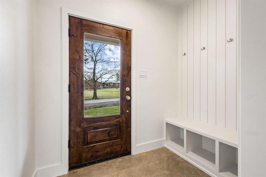 Mudroom featuring carpet floors