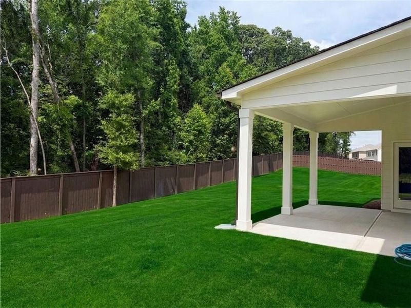 Exterior details and patio area of a home in Rosewood Lake Estates, Hoschton (Image 24).