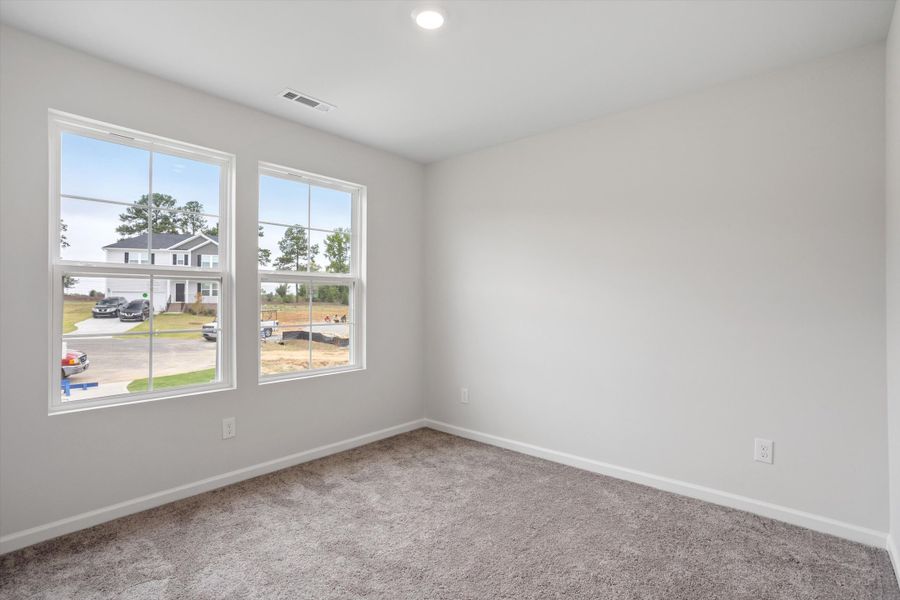 Spacious, unfurnished interior of a new home in Cambridge Reserve, Angier (Image 27).