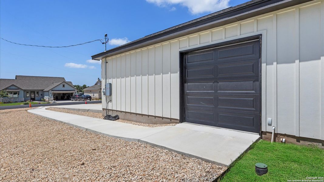 Front exterior of a new home in , Blanco, TX, highlighting curb appeal (Image 24).