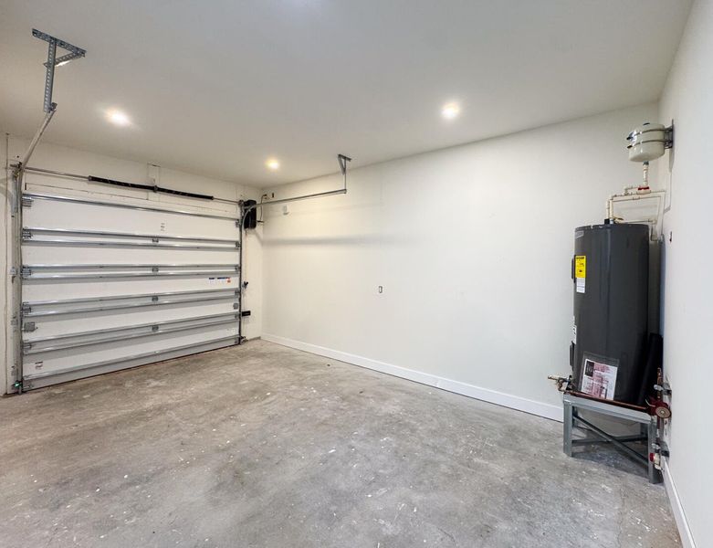 (as of April 8, 2026) Over-sized one-car garage. Side-mounted garage motor. Equipped with 220V electric vehicle plug.