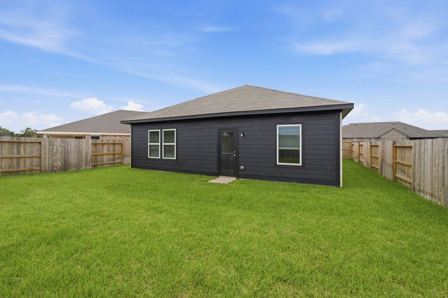 Exterior details and patio area of a home in Harvest Pointe, Needville (Image 4).