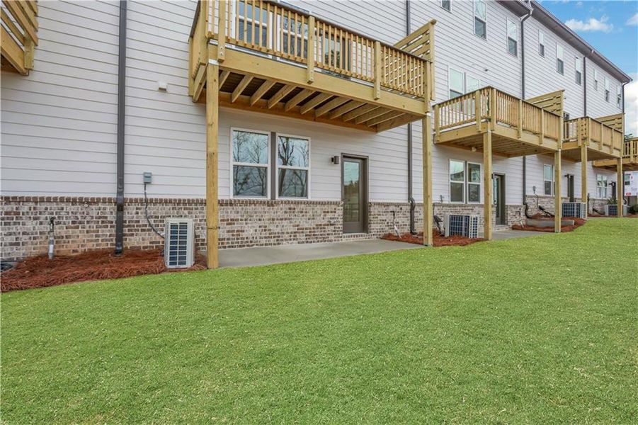 Exterior details and patio area of a home in Towne Village at Suwanee Dam, Sugar Hill (Image 25). Exterior details and patio area of a home in Towne Village at Suwanee Dam, Sugar Hill (Image 25).