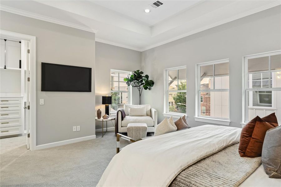 Primary suite offers high ceilings and a sense of tranquility.