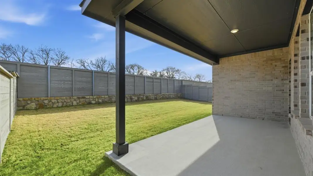Exterior details and patio area of a home in Treeline, Justin (Image 3).