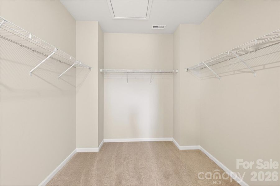 Primary walk-in closet Primary walk-in closet