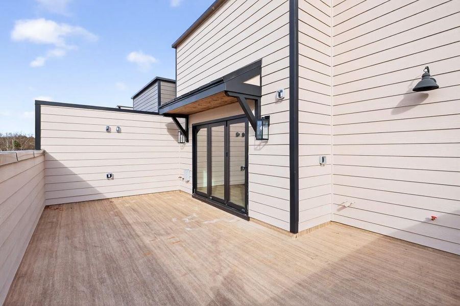 Exterior details and patio area of a home in Skyview On Broad, Sugar Hill (Image 22).