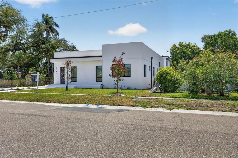 Front exterior of a new home in , St. Petersburg, FL, highlighting curb appeal (Image 25). Front exterior of a new home in , St. Petersburg, FL, highlighting curb appeal (Image 25).