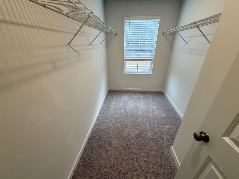 A hallway with a window. A hallway with a window.