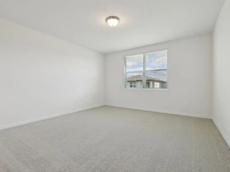 Spacious, unfurnished interior of a new home in Villamar - Signature Series, Winter Haven (Image 9).
