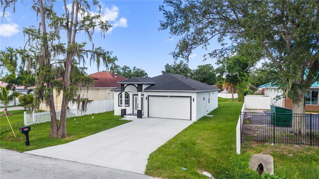 Front exterior of a new home in , Tampa, FL, highlighting curb appeal (Image 24).