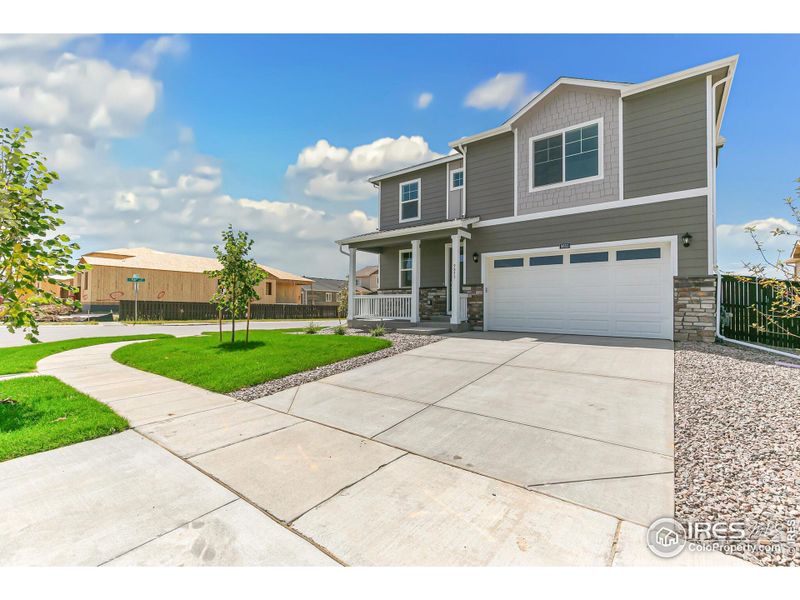 Front exterior of a new home in Settlers Crossing, Commerce City, CO, highlighting curb appeal (Image 17). Front exterior of a new home in Settlers Crossing, Commerce City, CO, highlighting curb appeal (Image 17).