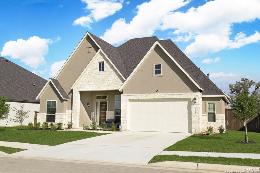 Front exterior of a new home in Mesa Western, Cibolo, TX, highlighting curb appeal (Image 2).