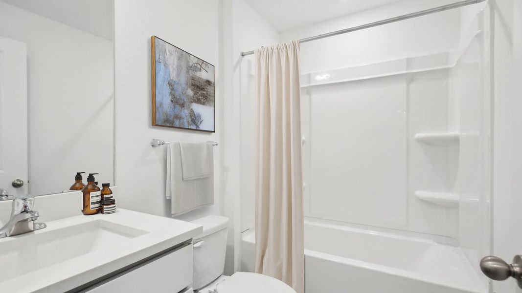 Representative furnished interior of a home built from the ARCHER II by D.R. Horton in Rye Crossing, Parrish (Image 12).