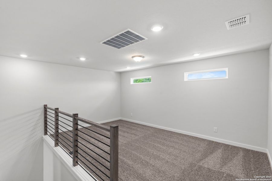 Spacious, unfurnished interior of a new home in The Meadows at Hunters Ranch, San Antonio (Image 12).