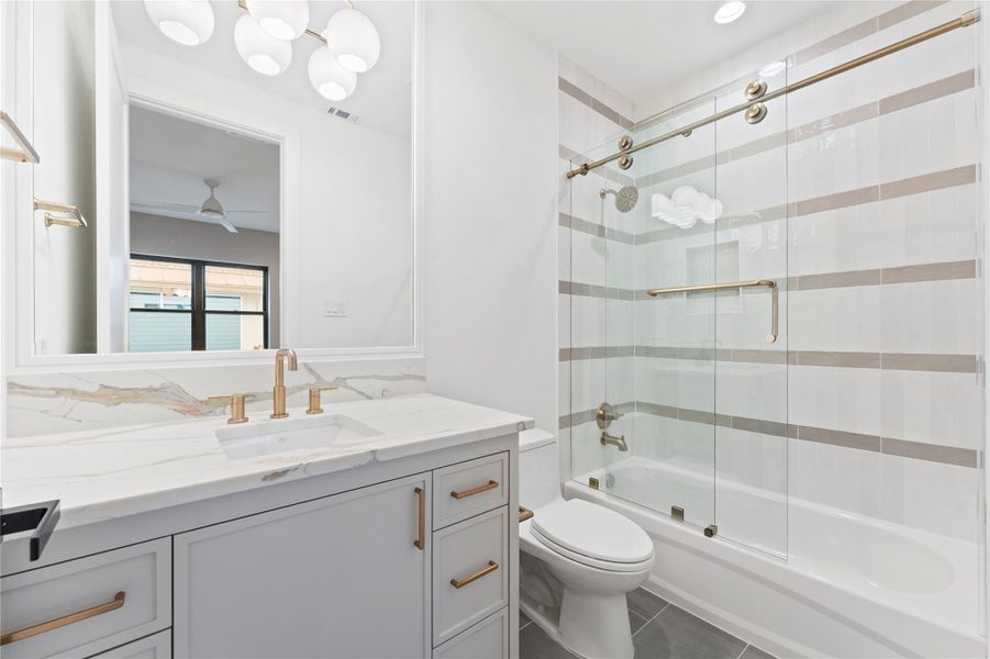 Stylish 2nd bathroom with contemporary tile and fixtures.