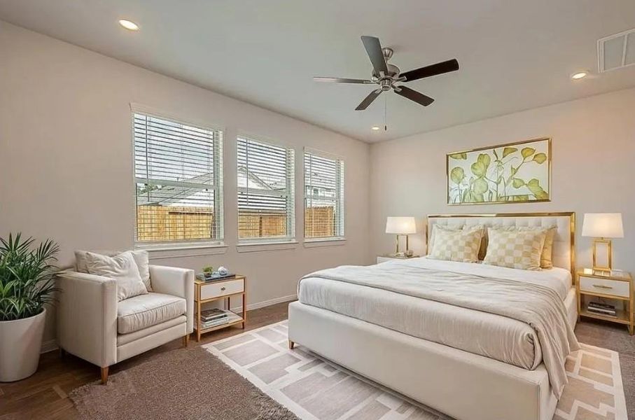Spacious first-floor primary suite offering comfort, privacy, and light pouring in.Virtually staged