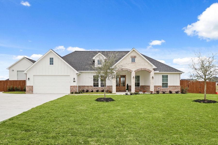 Front exterior of a new home in Blue Jay's Landing, Needville, TX, highlighting curb appeal (Image 2).