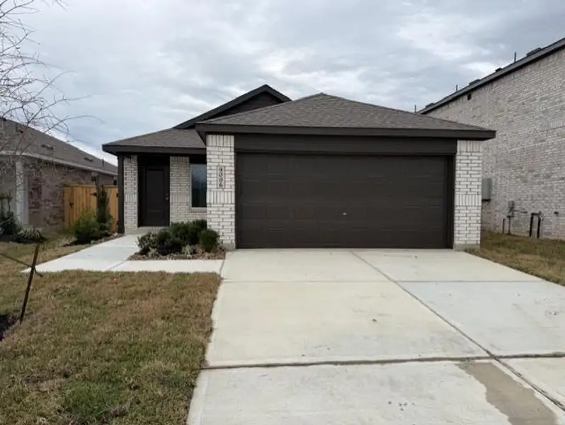 Front exterior of a new home in Pelly Place, Baytown, TX, highlighting curb appeal (Image 2).
