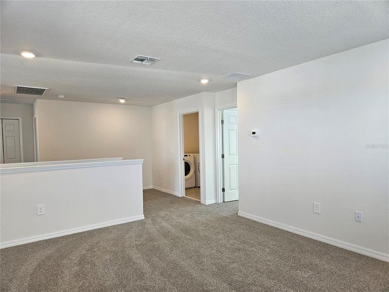 Spacious, unfurnished interior of a new home in Lawson Dunes - Signature Series, Haines City (Image 41).