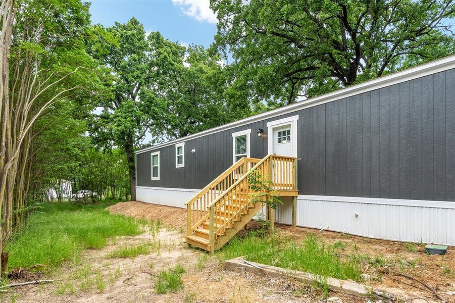 Front exterior of a new home in , Mabank, TX, highlighting curb appeal (Image 15). Front exterior of a new home in , Mabank, TX, highlighting curb appeal (Image 15).