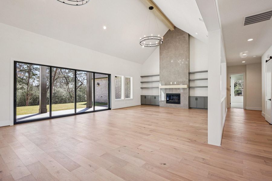 living room with tile fireplace