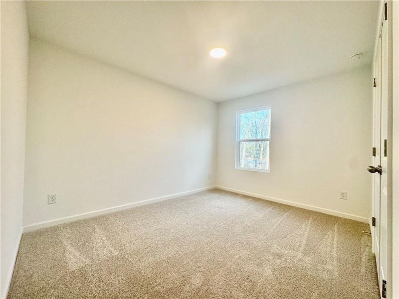 Spacious, unfurnished interior of a new home in Eastlyn Crossing, Flowery Branch (Image 20).
