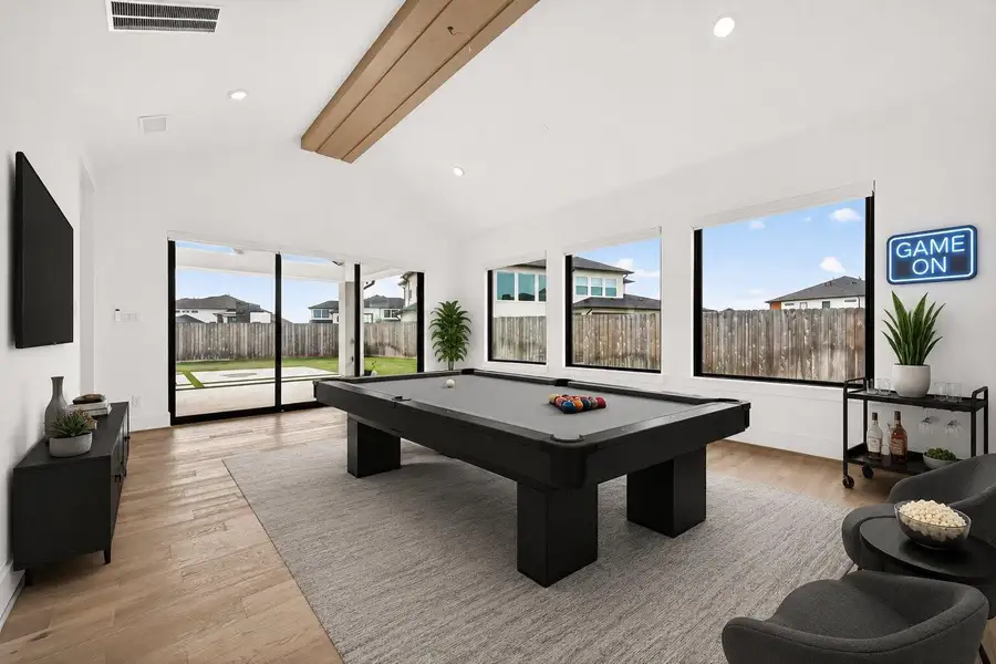 Game Room: *Virtually Staged** to showcase the space’s versatile design potential and inspire a variety of furnishing and décor possibilities. Images are for illustrative purposes only and may not reflect the room’s current appearance or actual furnishings.