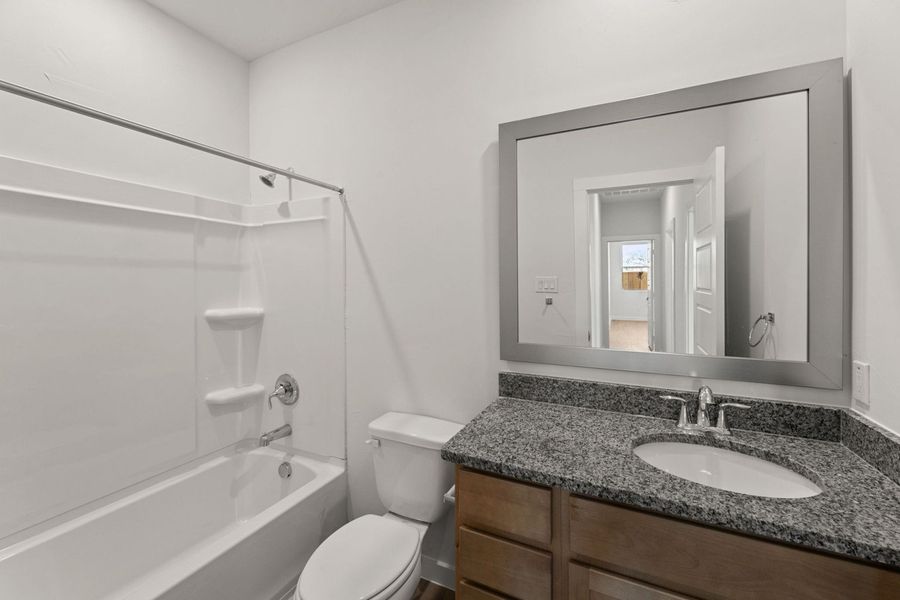 Representative furnished interior of a home built from the Clovis by Hakes Brothers in Hunters Ranch, San Antonio (Image 8).