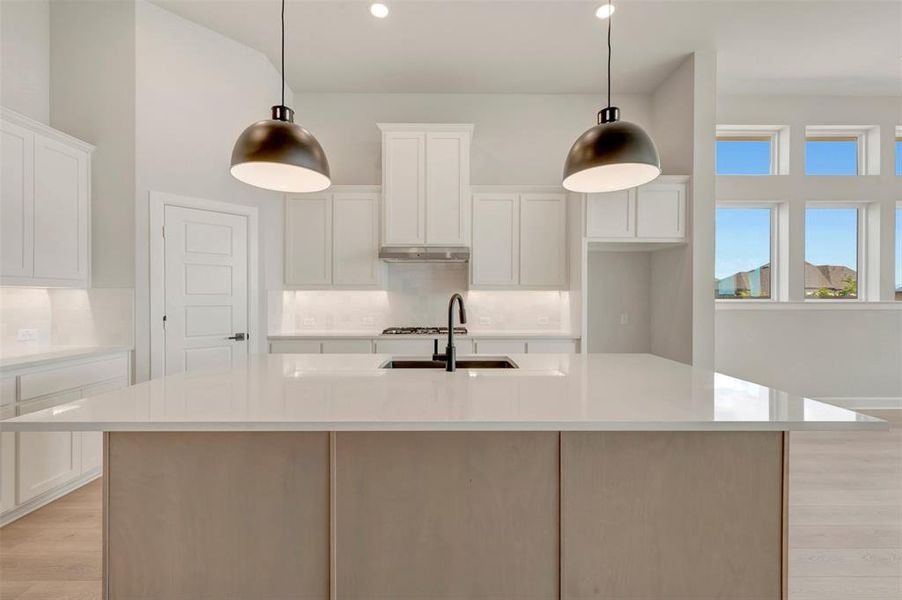Spacious kitchen island with a light-toned countertop