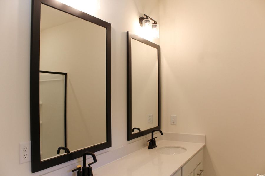 Bathroom featuring double vanity Bathroom featuring double vanity