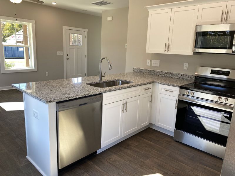 Representative furnished interior of a home built from the Tyler II by Foundation Home Builders LLC in Pinnix Loop, Burlington (Image 6).