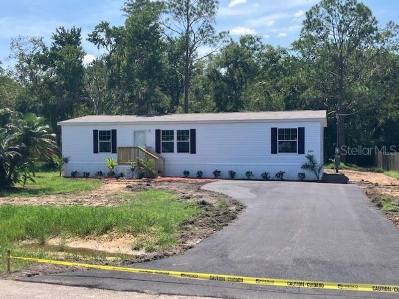 Front exterior of a new home in , Wesley Chapel, FL, highlighting curb appeal (Image 9).