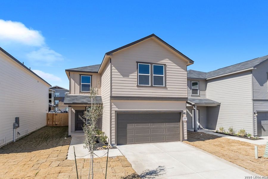 Front exterior of a new home in Medina Crossing, Von Ormy, TX, highlighting curb appeal (Image 1). Front exterior of a new home in Medina Crossing, Von Ormy, TX, highlighting curb appeal (Image 1).