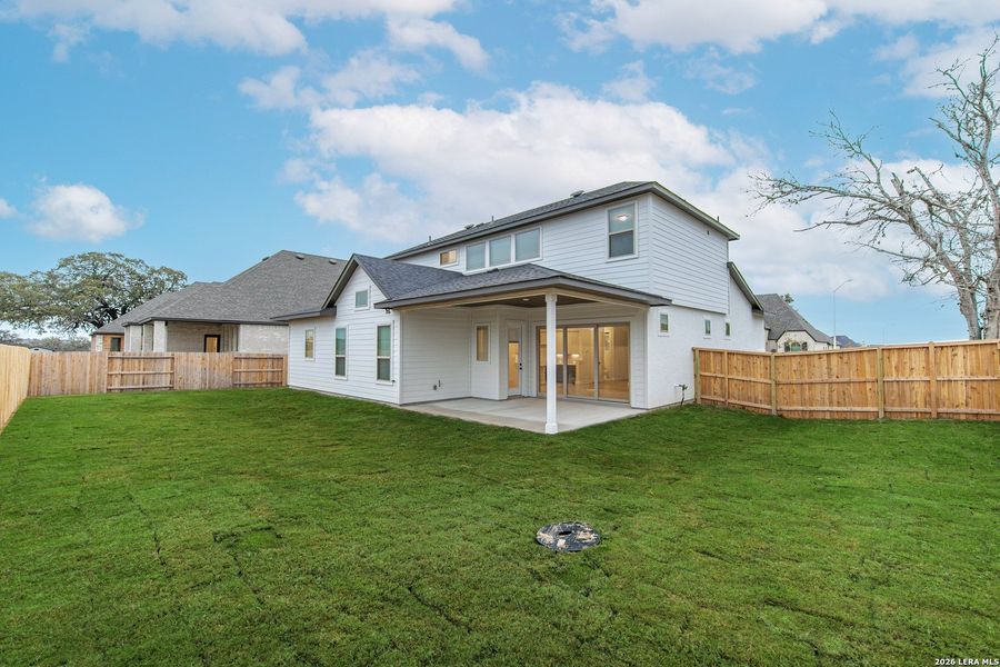 Exterior details and patio area of a home in The Reserve at Potranco Oaks, Castroville (Image 3).