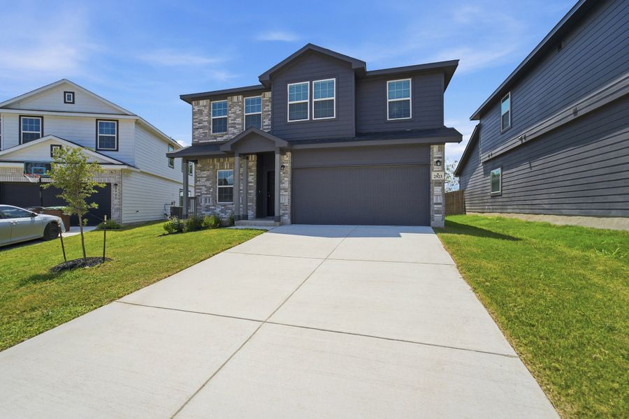 Front exterior of a new home in Laurel Vistas, San Antonio, TX, highlighting curb appeal (Image 29).