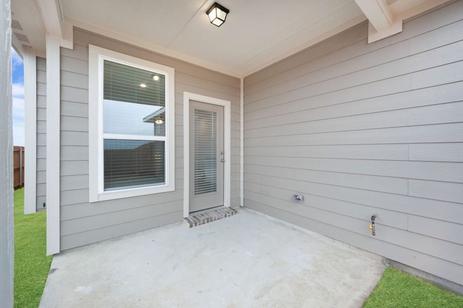 Representative exterior photo of a completed home built from the Joliet by Impression Homes in Heartland, Heartland, TX (Image 24).